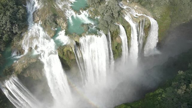 Drone establishes grand cascades of water from strong flowing stream of Tamul Waterfall, Mexico