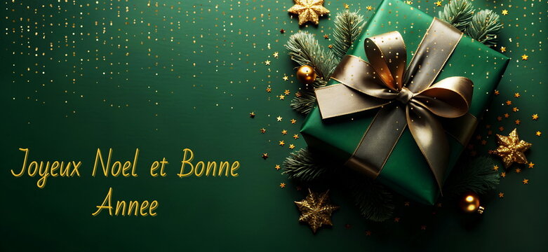 Joyeux Noel et Bonne Annee, Christmas greeting card french, xmas gift box top view on green background  banner.Copy space