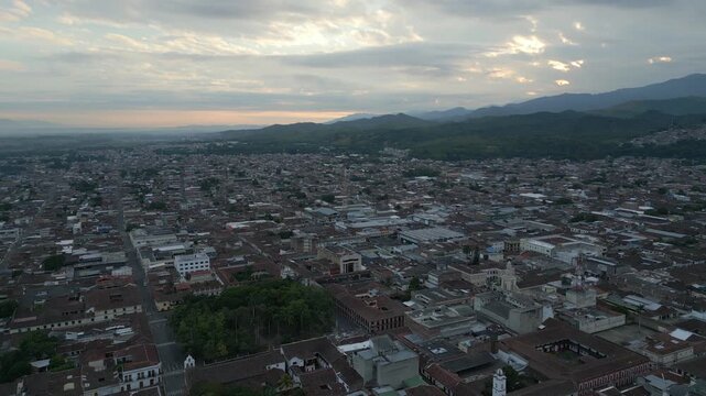 Aerial View Buga Pull Back at Sunrise. Establishing Shot