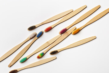 Colorfull bamboo toothbrushes on white background, eco-friendly oral hygiene, tooth care, personal toothbrush for everyday use. Minimal aesthetic flat lay, top view Zero waste, organic product