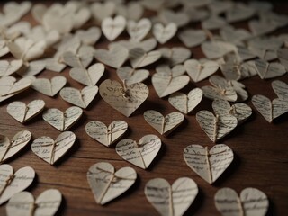 Obraz premium Handmade small paper hearts with strings.