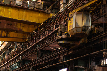 Old factory with objects abandoned inside and growing nature, power of life