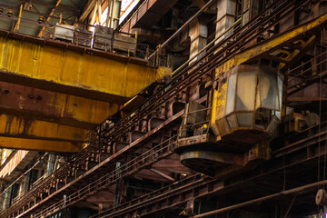 Old factory with objects abandoned inside and growing nature, power of life