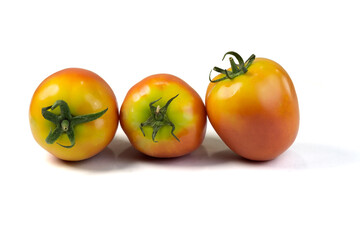 Group of fresh ripe tomatoes isolated on white background with clipping path closed up. 