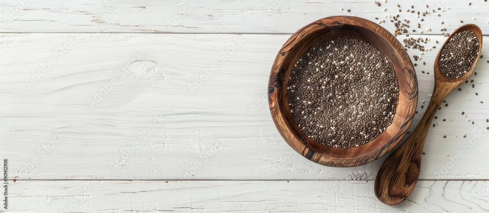 Aufkleber top view of a wooden bowl with chia seeds and a spoon on a white wooden surface providing copy space