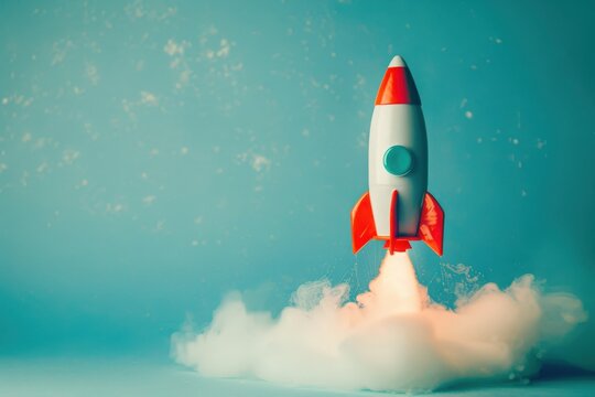 A bright toy rocket ascends into the air, leaving a trail of white smoke amidst a serene blue backdrop, evoking dreams of exploration and adventure.