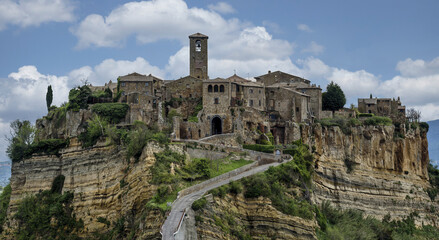 Fototapeta premium Civita di Bagnoregio (Viterbo, Italy), an idyllic medieval village, is one of the most beautiful villages in Italy due to its position and its wonderful medieval houses and alleys