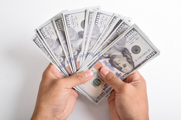 American dollars or US dollars. Man hand counting one hundred American money or 100 USD. Concept of finance, business, income.