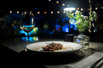 Tender Pork Chunks on a Plate Surrounded by a Stunning Blue Ambiance: A Captivating Culinary Experience