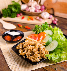 Crispy Fried Oyster Mushroom or Jamur Krispi. Oyster Mushroom Coated with Spiced Flour and Depp Fried. Usually Served with Tomato Sauce and Fresh Vegetables