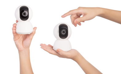Hand hold wireless security camera on white background.