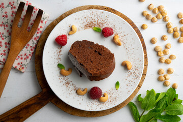 Delicious piece of chocolate cake seen from an overhead perspective.