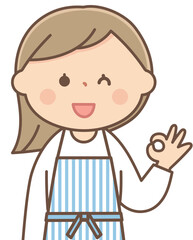 オッケーサインをするエプロンをした主婦