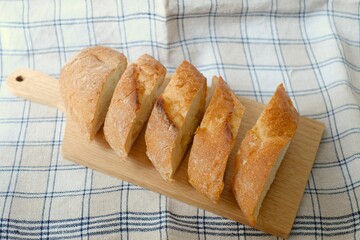 sliced baguette on the wooden board