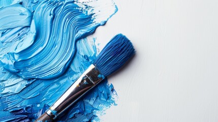 a paintbrush with blue color on a white background, perfect for art school or for articles about artists or hobbies