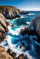 Fototapeta premium rocky shoreline crashing waves rugged terrain under clear sky, beach, coastline, ocean, sea, rocks, cliffs, surf, foam, landscape, water, spray, pebbles