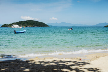 the tropical landscape of the island with white sand and palm trees. Quiet and peaceful rest, a secluded romantic place