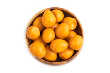 Pile of Smoked Quail eggs isolated on white, top view, close up.
