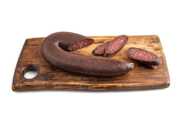 Sujuk sausage isolated on wooden cutting board on white. Side view.