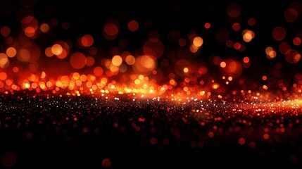 Obraz premium On a dark background, a festive abstract christmas texture with golden bokeh particles is used