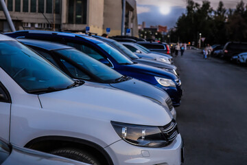 Cars in a large parking lot in the city