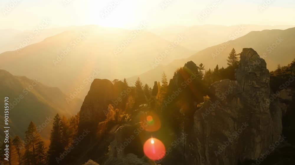 Poster The suns rays slowly creep down the slopes illuminating the trees and rocks along the way.
