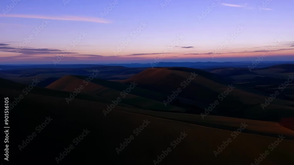 Poster A tranquil journey through rolling hills illuminated by the soft dusky light of twilight.