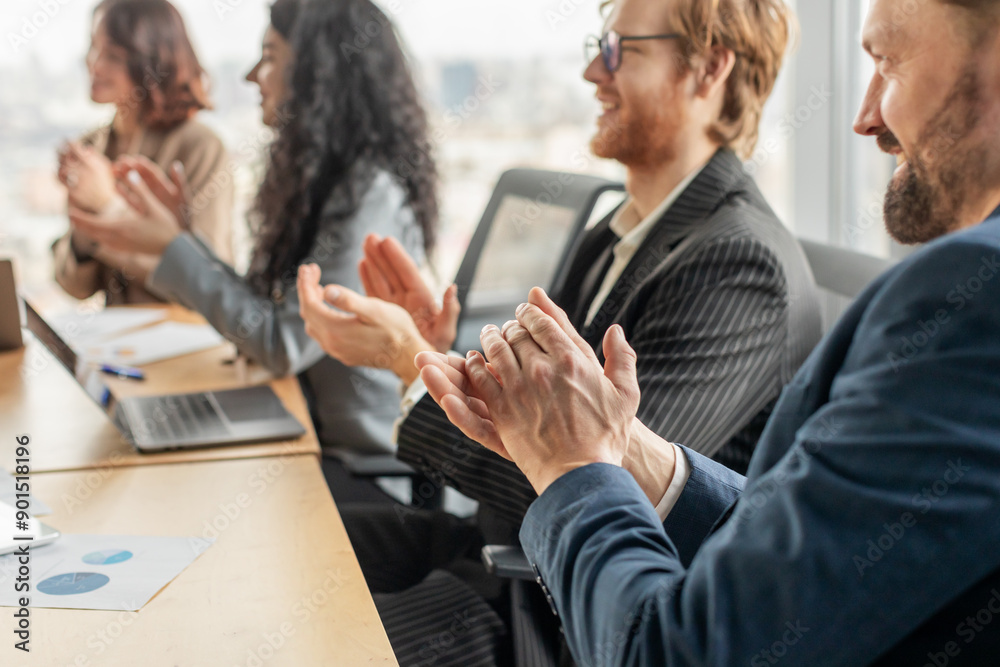 Aufkleber a group of business professionals are seated around a conference table, clapping their hands in appr