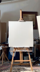 An empty canvas on an easel in a bright artist studio, inviting creativity and inspiration for painting
