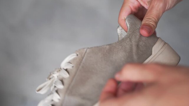 Close-up of well-used sneakers, highlighting the wear and tear, representing the underconsumption core trend focused on sustainability and mindful consumption