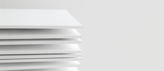 Photo paper stacked neatly with a white backdrop providing ample copy space for images