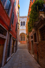 Venice, Italy - June 05, 2024: Narrow empty pedestrian street.