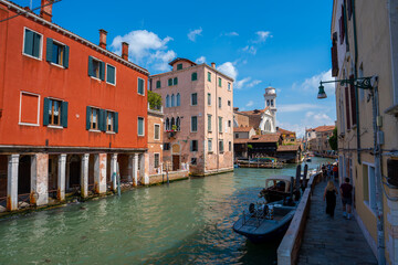 Venice, Italy - June 05, 2024: Venetian Canal Scene with Iconic Architecture.