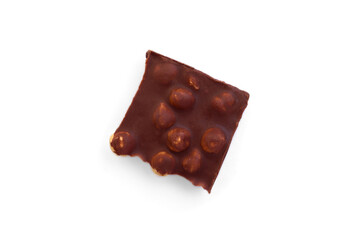 Milk chocolate with whole hazelnuts isolated on white background.