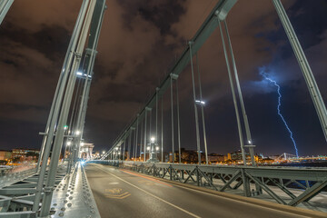 Fototapeta premium Budapest, Hungary: July 18, 2024: Storm view from Szechenyi Chain Bridge. Long exposure shot.