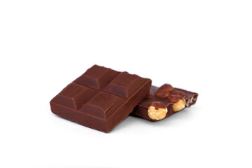 Milk chocolate with whole hazelnuts isolated on white background.