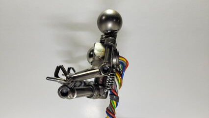 Scrap metal welding art sculpture of Robot Meditating in a Peaceful yoga poses. Zen Robotics deep...