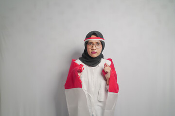 Woman in a Hijab Holding Indonesian Flag