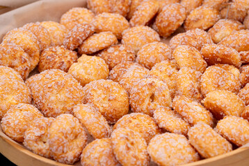 Puff pastries, round sugar-coated sugar puffs, golden crispy baked sweets, traditional French...