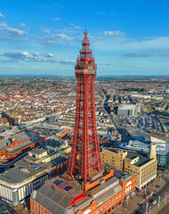 Obraz premium Aerial Image of Blackpool Tower along the Fylde Coast, Lancashire during a lovely Summer evening on the Sea front. 28th July 2024.