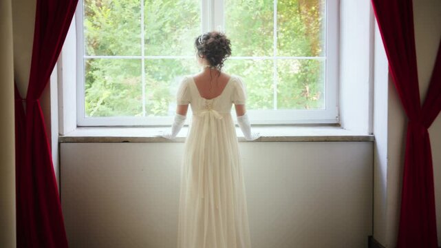 Happy woman looking out window, waiting for love. Fantasy fairy sexy lady Happy Princess girl, white silk vintage long dress old style ball gown, high bun black hair hairstyle back rear view. art 4k