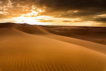 Sunset over the sand dunes in the desert. Sahara desert