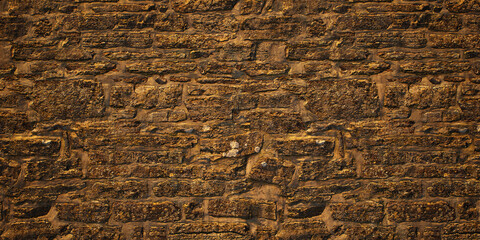 Texture of an old rough stone castle wall.