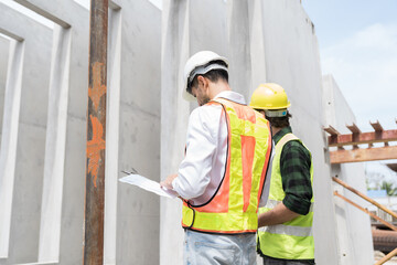 Team of male engineer construction working and inspecting structure of building at construction...