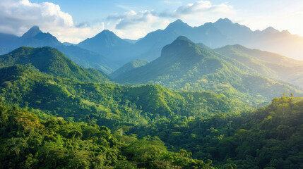 Stunning landscape view of lush green mountains and valleys under a bright sky, showcasing the beauty of nature in a tropical region.