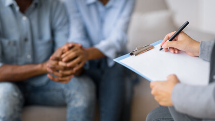 Professional Couples Therapy. Unrecognizable Afro Spouses Holding Hands Visiting Marital Counselor. Selective Focus, Cropped
