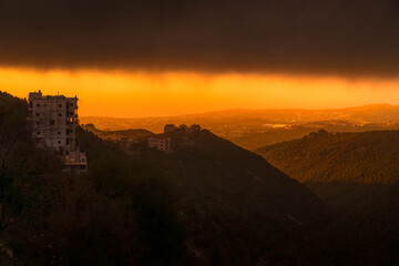 Obraz premium The beautiful sunset over Lebanon coast, at Mediterranean sea, with bright colors, city panorama, and Middle East landscape. 