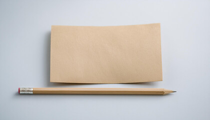 Empty paper craft post card with pencil on neutral background. Mock-up. Close-up.
