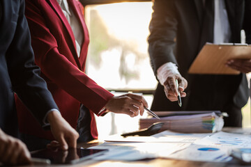 Business meeting, Company executives meeting discussing strategic analysis and business planning, group of people working with paperwork on a board room table at a business presentation or seminar.