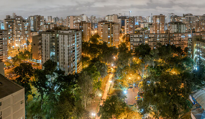 Nocturnal aerial view of San Felipe housing in Lima, Peru, highlighting urban architecture and...